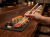 Pałeczki do Sushi 21cm drewniane grawerowane THE CARLYCE CLUB z sushi.png